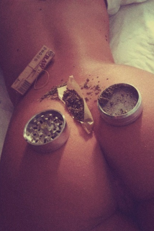 Rolling weed on naked woman